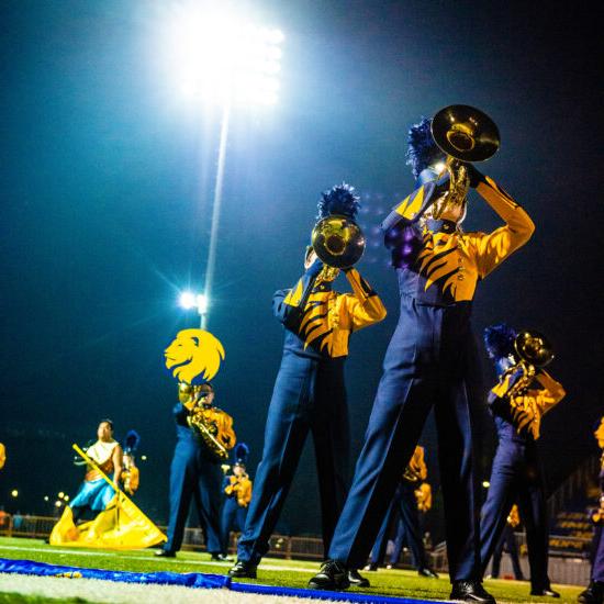 Marching band playing.